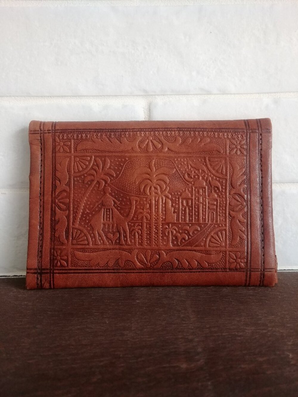 Brown embossed leather wallet multiple compartments